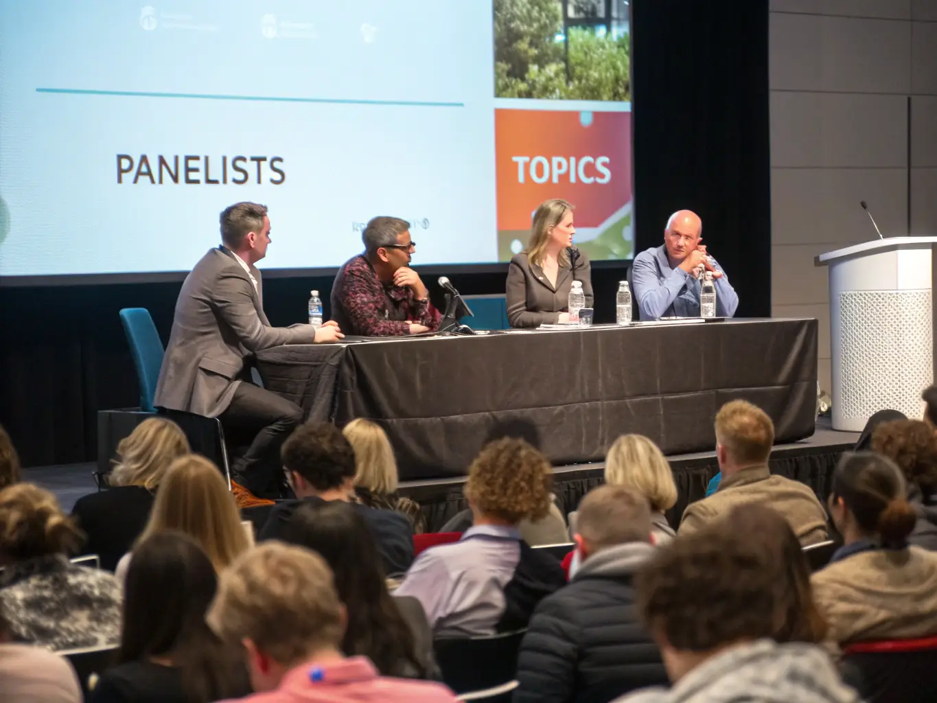 A dynamic image capturing a panel discussion at the Fintech Innovation Summit, featuring industry experts debating investment strategies and financial growth opportunities.